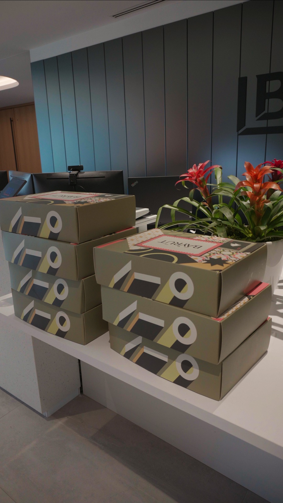 Stacks of BÁYRŪT lunch boxes ready for a team order